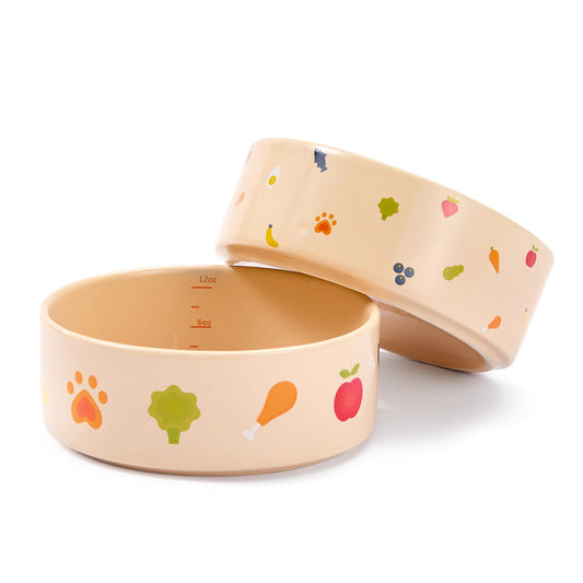 Two bamboo bowls with colorful prints on a white background