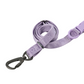 Purple dog leash with a black clip on a white background