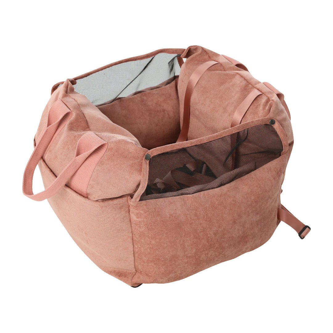 Pink pet carrier with transparent window on a white background
