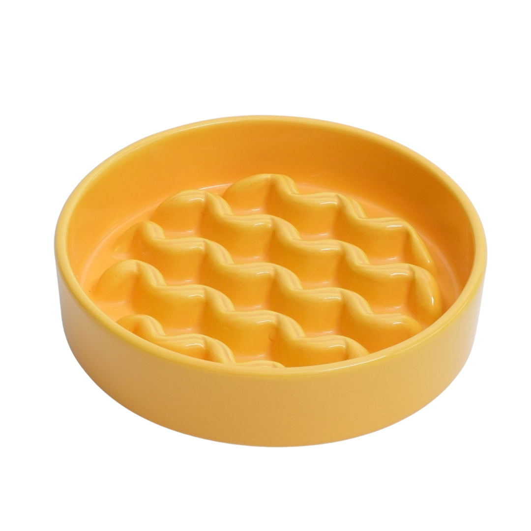 Yellow textured bowl on a white background