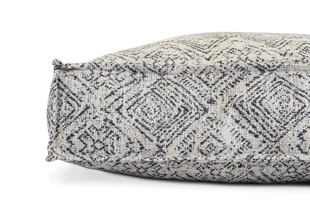 Textured patterned pillow on a white background